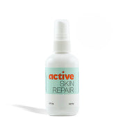 Bottle of active skin repair spray on a white background